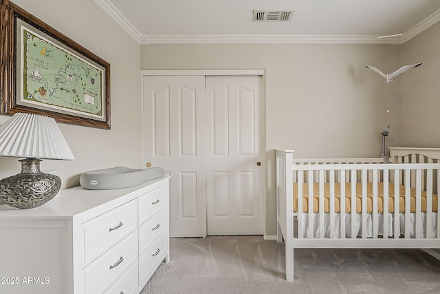bedroom featuring light colored carpet, crown molding, visible vents, and a closet