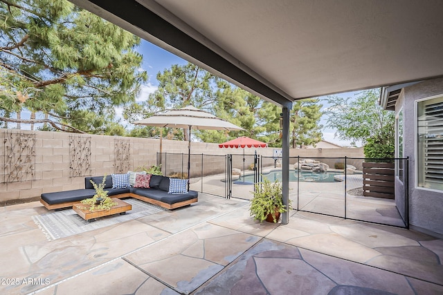 view of patio / terrace featuring a fenced backyard, a fenced in pool, and an outdoor hangout area