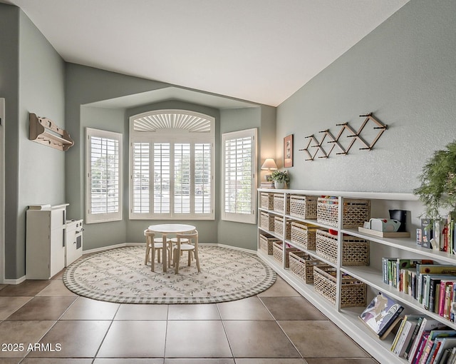 interior space with tile patterned flooring and baseboards