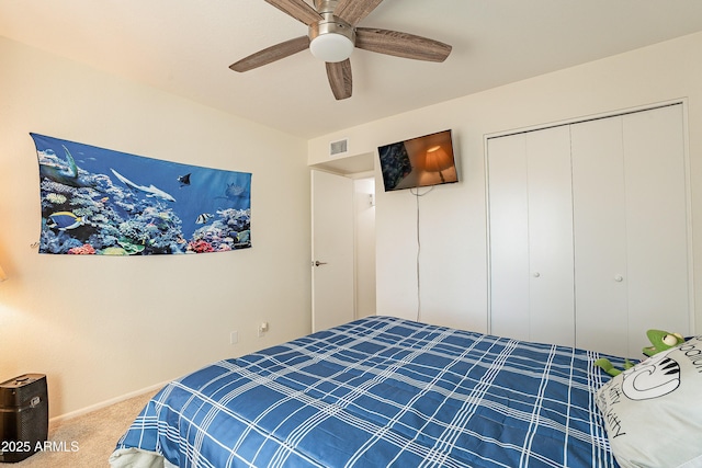 bedroom featuring carpet floors, a closet, and ceiling fan