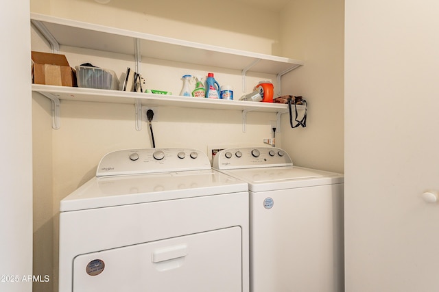 clothes washing area featuring washing machine and dryer