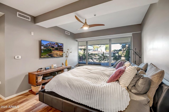 bedroom featuring hardwood / wood-style floors and ceiling fan