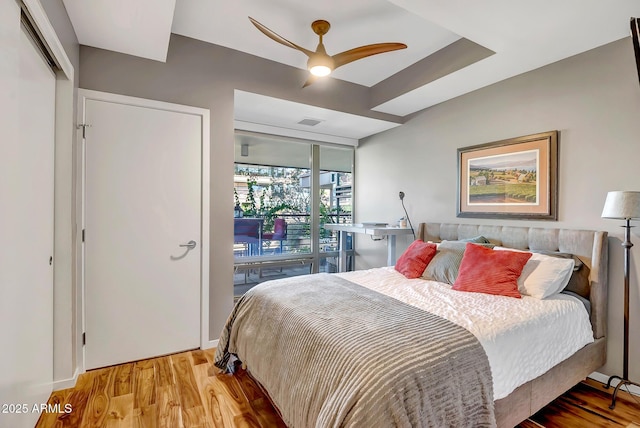 bedroom featuring ceiling fan and light hardwood / wood-style flooring