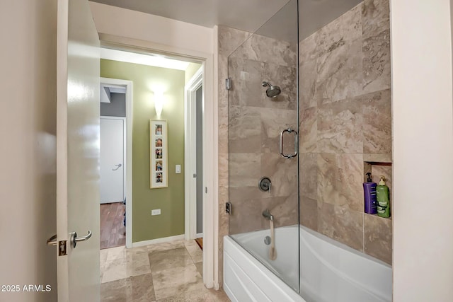 bathroom with shower / bath combination with glass door