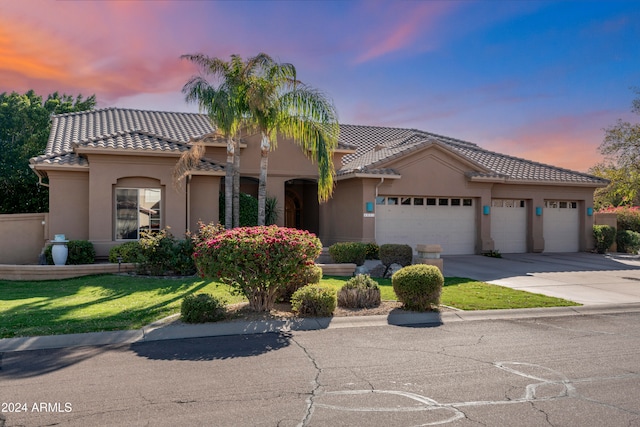 mediterranean / spanish-style home featuring a garage