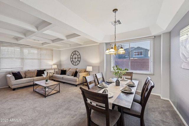 dining space with beam ceiling, coffered ceiling, carpet floors, and a chandelier