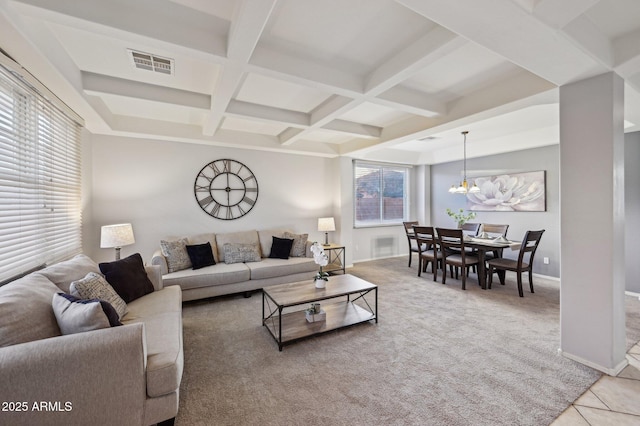 carpeted living room with plenty of natural light, coffered ceiling, and beam ceiling