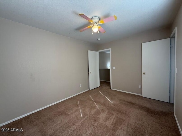 unfurnished bedroom featuring carpet floors and ceiling fan