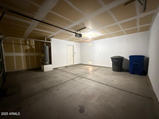 garage featuring a garage door opener and water heater