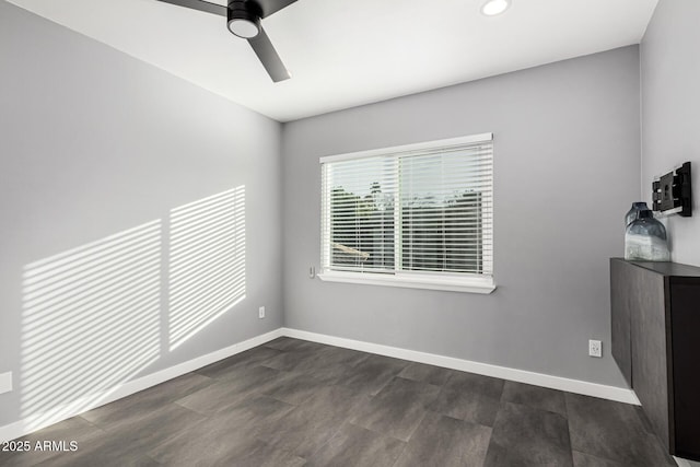 unfurnished room with ceiling fan