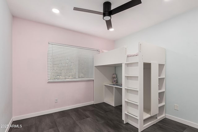 unfurnished bedroom featuring ceiling fan