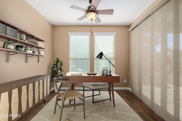 home office featuring ceiling fan and dark hardwood / wood-style floors