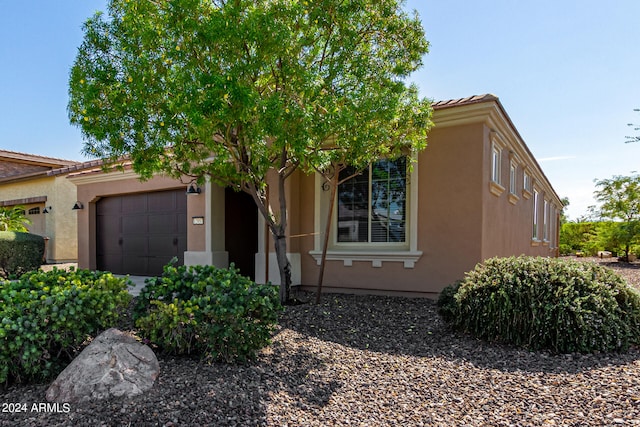 view of front of home with a garage