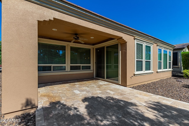 view of patio featuring ceiling fan