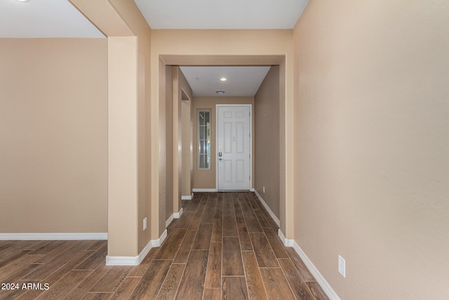 corridor featuring dark hardwood / wood-style flooring