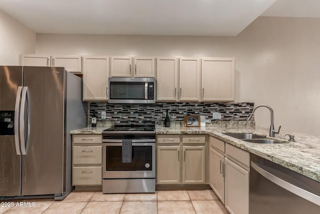205 N 74th St Unit 166, Mesa, AZ 85207 - kitchen featuring stainless steel appliances, backsplash, light tile patterned flooring, and light stone counters