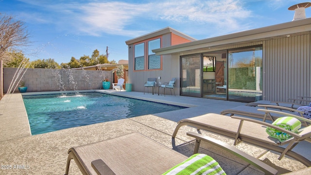 view of pool featuring a patio area