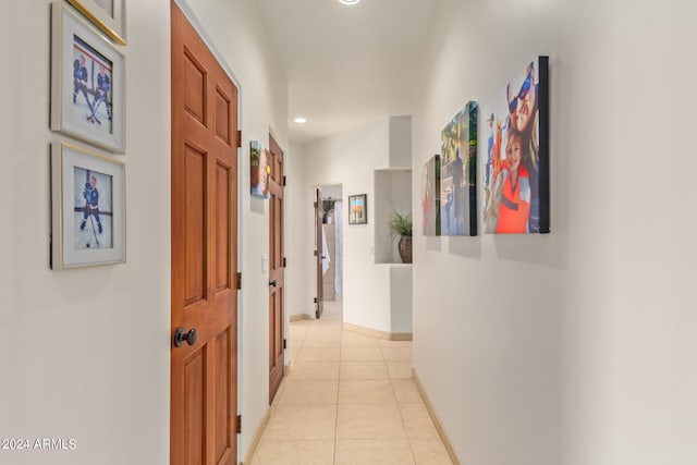 hall with light tile patterned flooring