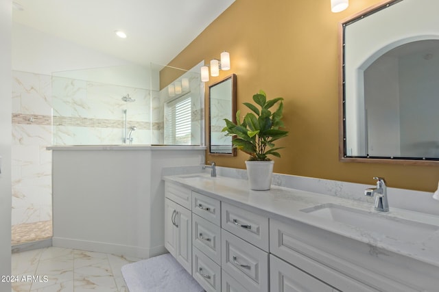 bathroom with vanity and a shower