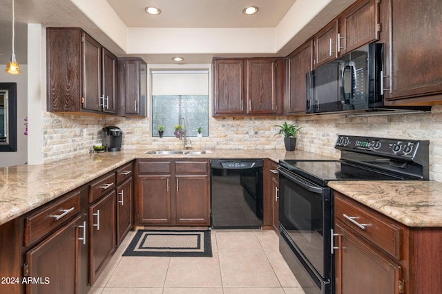 kitchen featuring black appliances, sink, decorative backsplash, light tile patterned floors, and decorative light fixtures