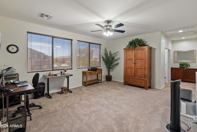 carpeted office with ceiling fan