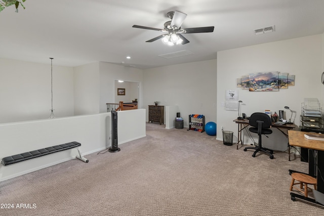 office area featuring light carpet and ceiling fan