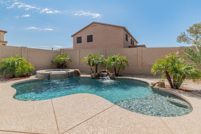 view of pool with an in ground hot tub