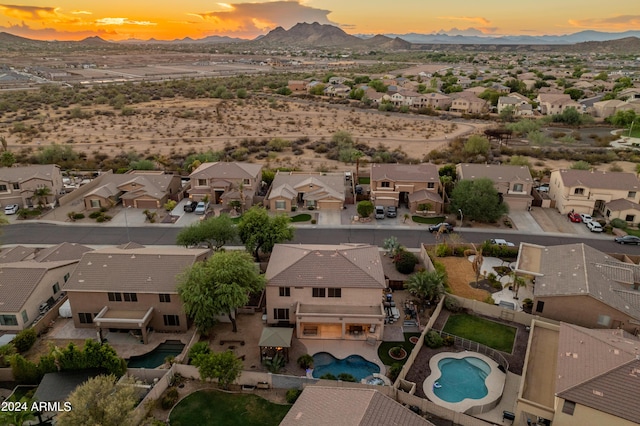 aerial view at dusk with a mountain view