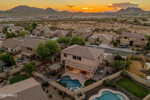 aerial view at dusk with a mountain view