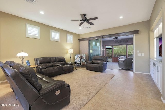 living room featuring ceiling fan and light tile patterned flooring