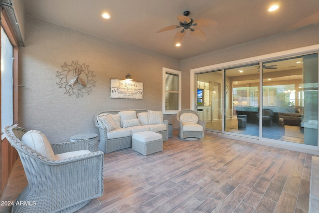 exterior space featuring ceiling fan and hardwood / wood-style floors