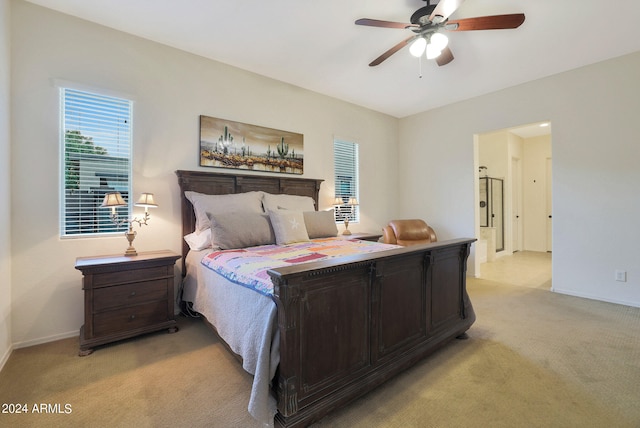 bedroom featuring ceiling fan and light colored carpet