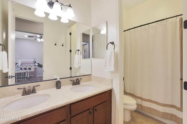 bathroom featuring walk in shower, tile patterned flooring, vanity, and toilet