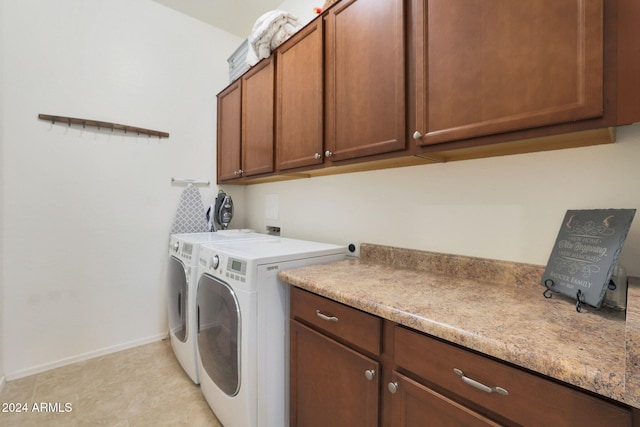 laundry area featuring cabinets and washer and dryer