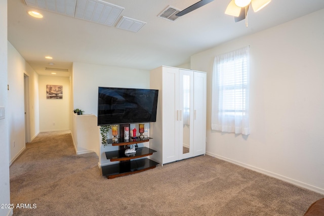 16425 W Latham St, Goodyear, AZ 85338 - carpeted living area featuring a ceiling fan, baseboards, and recessed lighting