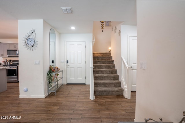 16425 W Latham St, Goodyear, AZ 85338 - foyer with wood finish floors, stairway, and recessed lighting