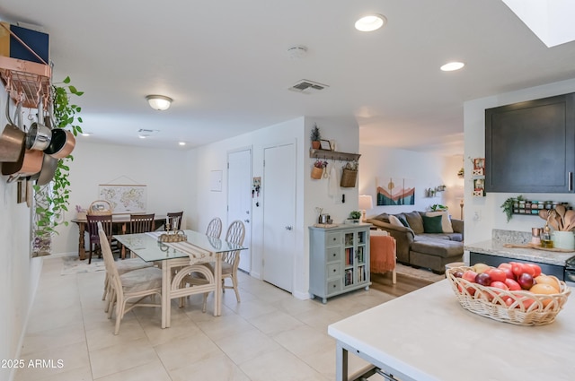 dining area featuring recessed lighting, visible vents, and light tile patterned floors