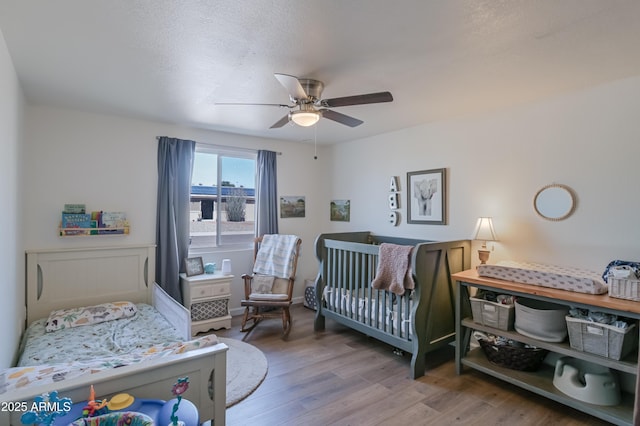 bedroom featuring ceiling fan and wood finished floors