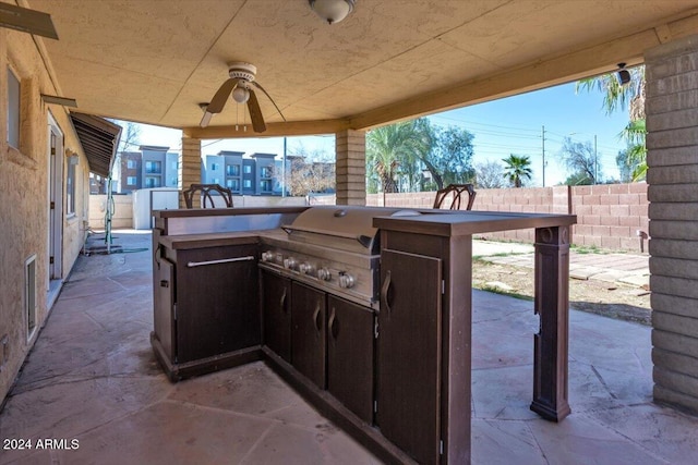 view of patio with a grill and ceiling fan