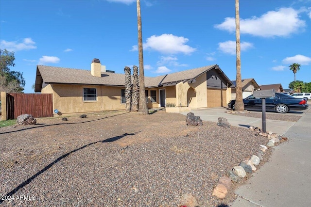 ranch-style home with a garage