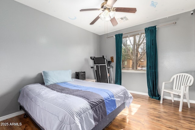 bedroom featuring hardwood / wood-style flooring and ceiling fan