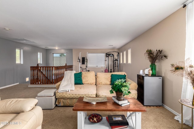 living room with a wealth of natural light and light colored carpet