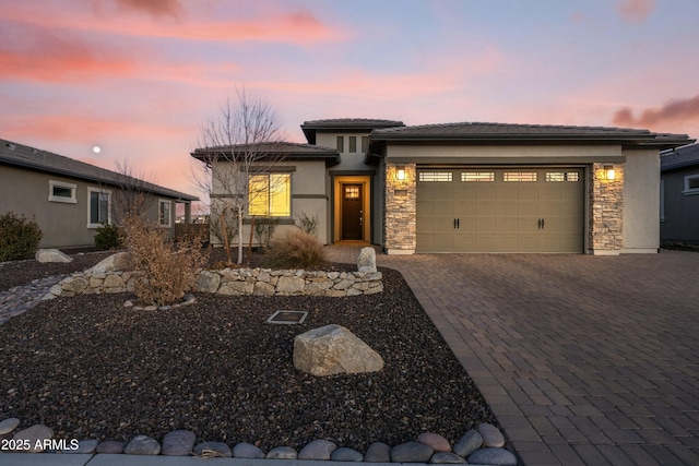 prairie-style home featuring a garage