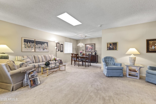 carpeted living room featuring a chandelier and a textured ceiling