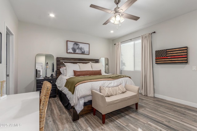 4446 W Kimberly Way, Glendale, AZ 85308 - bedroom with light wood-type flooring, recessed lighting, baseboards, arched walkways, and a ceiling fan