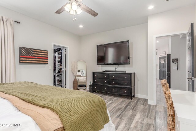 4446 W Kimberly Way, Glendale, AZ 85308 - bedroom with wood finished floors, a spacious closet, recessed lighting, baseboards, and ceiling fan