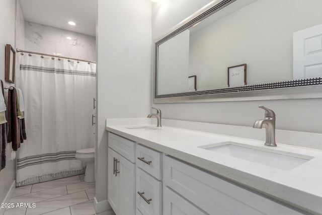 4446 W Kimberly Way, Glendale, AZ 85308 - full bath with marble look tiles, toilet, double vanity, a shower with shower curtain, and recessed lighting
