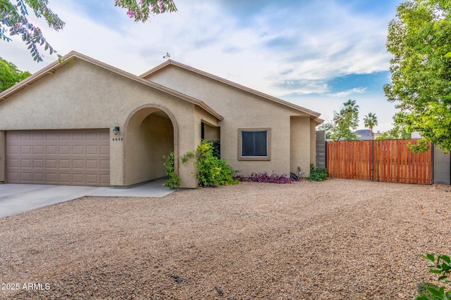 4446 W Kimberly Way, Glendale, AZ 85308 - view of front facade with concrete driveway, an attached garage, and stucco siding