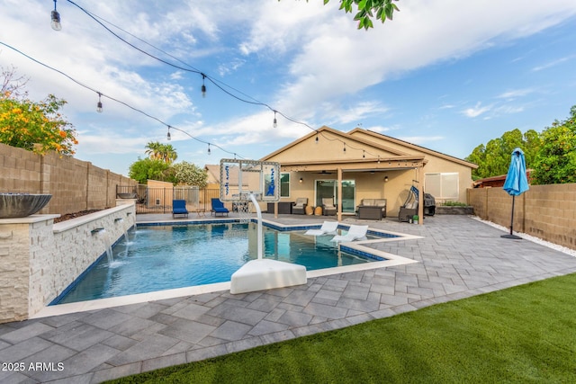 4446 W Kimberly Way, Glendale, AZ 85308 - view of pool with an outdoor hangout area, a patio area, a fenced backyard, and a ceiling fan