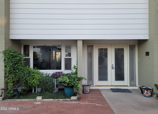 view of exterior entry featuring french doors